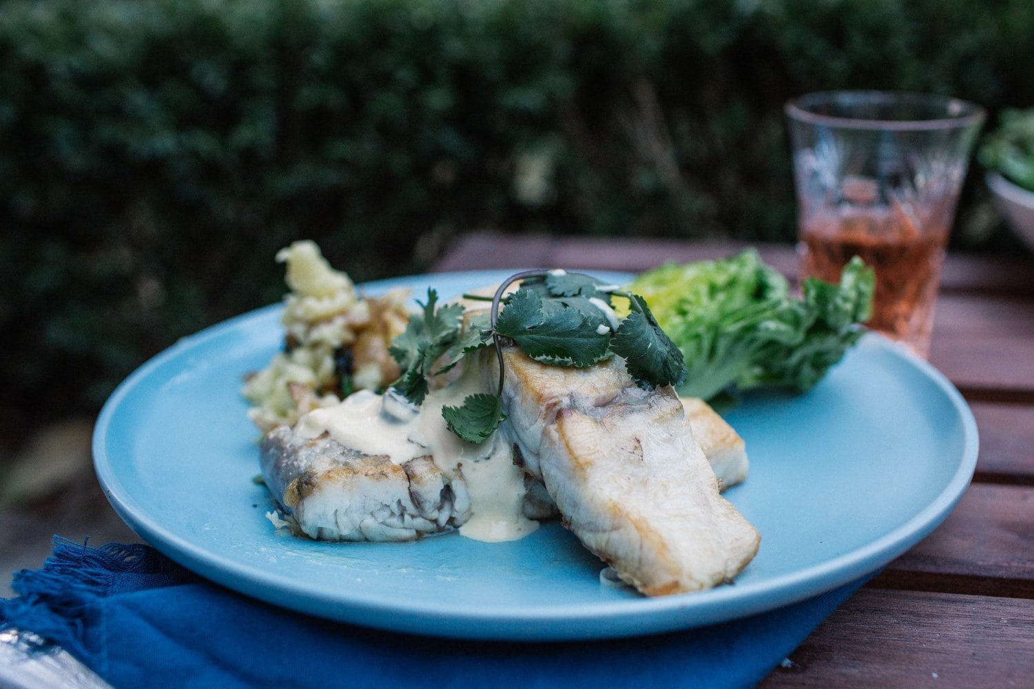 Crispy Skinned Barramundi with Smashed Potatoes and Baby Cos and Mint Salad with Citrus Dressing